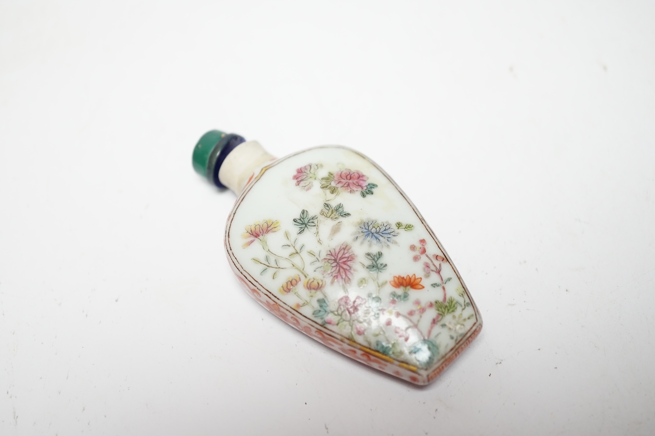 A Chinese famille rose snuff bottle, Jiaqing mark and of the period (1796-1820), rim ground off, 7cm high